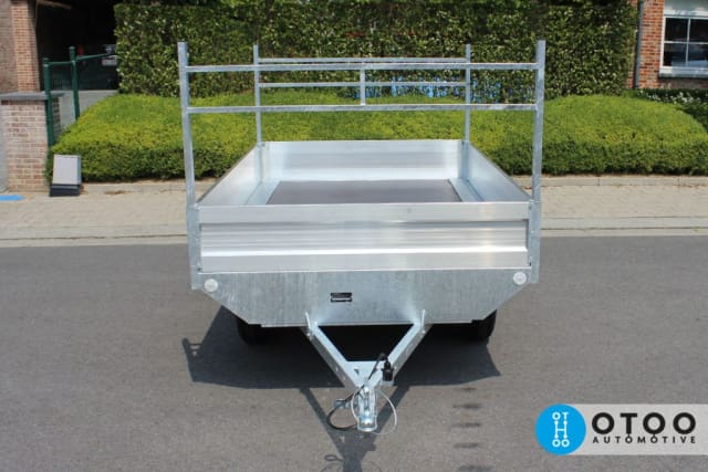 Platform trailer with aluminum boards 30 cm high and ladder rack mounted both front and rear on the tube profiles of the trailer.